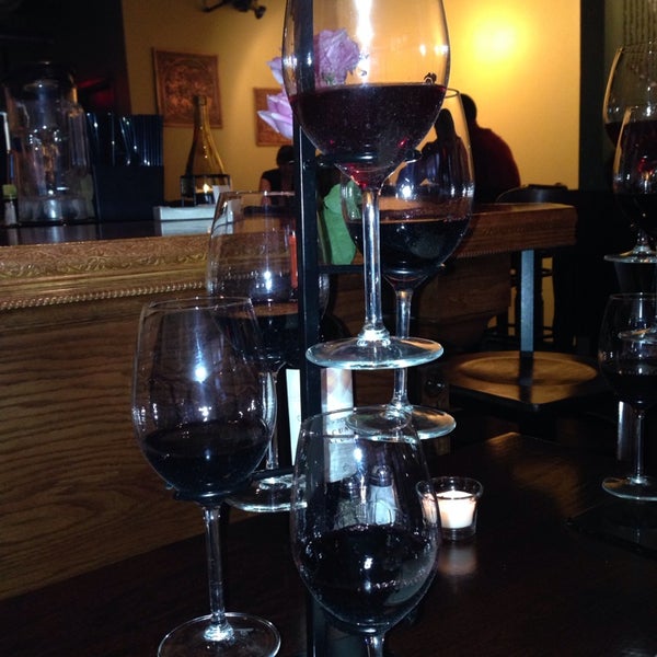 Photo taken at Pochi Restaurant - Chilean Cuisine and Wine Bar by Kat G. on 4/17/2014
