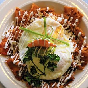 Check out Mexican brunch favorite chilaquiles. This fabled hangover cure includes a hefty smattering of fried corn tortilla, chorizo, salsa and over-easy eggs topped with guacamole and queso fresco.