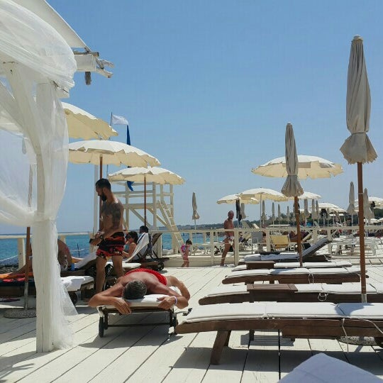 Photo taken at Coco Beach Club, Cozze - Polignano a mare by Irmak T. on 7/11/2016
