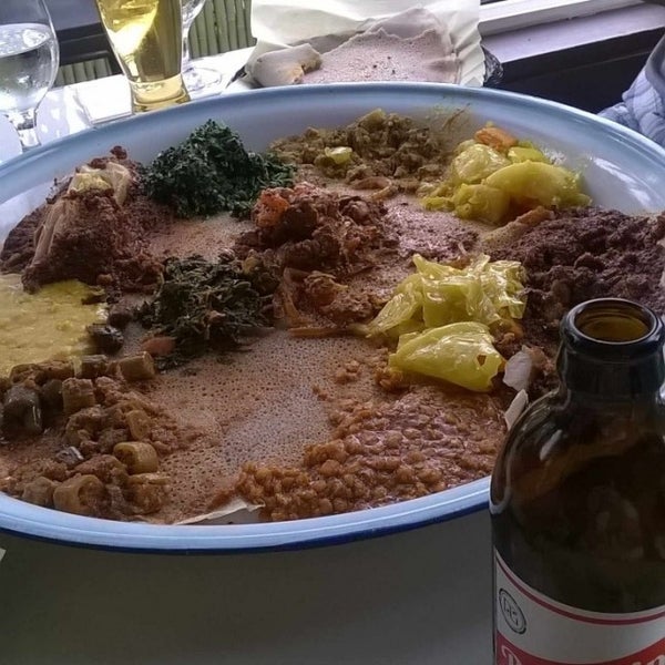 Photo taken at Queen Sheba Ethiopian Restaurant by Aaron K. on 8/3/2015