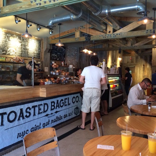 Photo taken at Toasted Bagelry &amp; Deli by Andrew C. on 7/4/2014