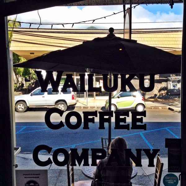 Photo taken at Wailuku Coffee Company by Erik B. on 7/25/2014