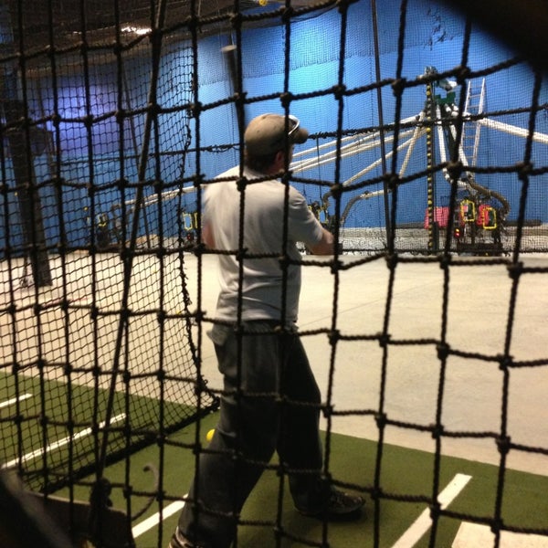 Photo taken at Grand Slam Sports &amp; Entertainment by Tino L. on 3/13/2013