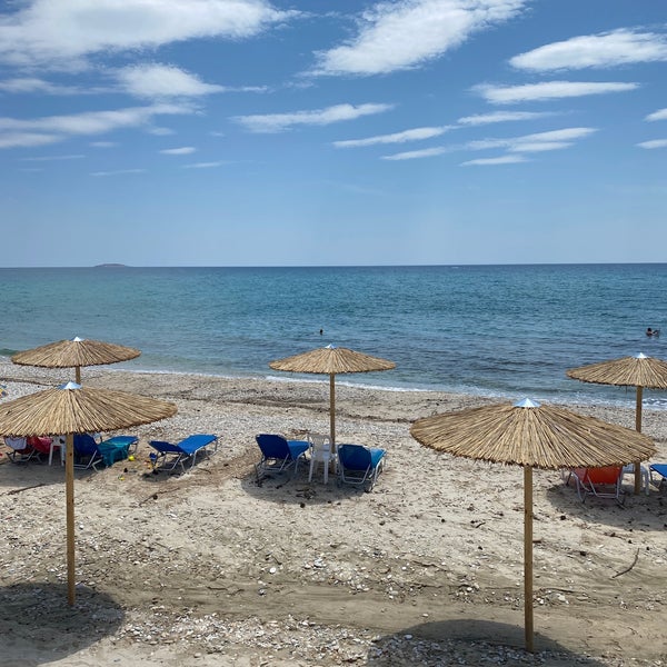 Photo taken at Stelakis Beach by Ольга on 6/13/2022