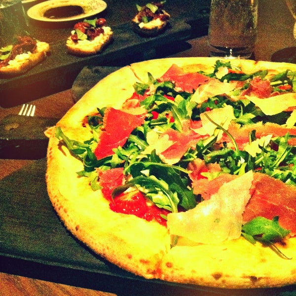 Pizza with Prosciutto is the best. As a starter, the Buffalo Bruschetta is a great choice.
