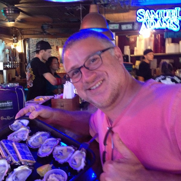 Photo taken at Shuckums Oyster Pub &amp; Grill by Cyrus K. on 6/27/2014