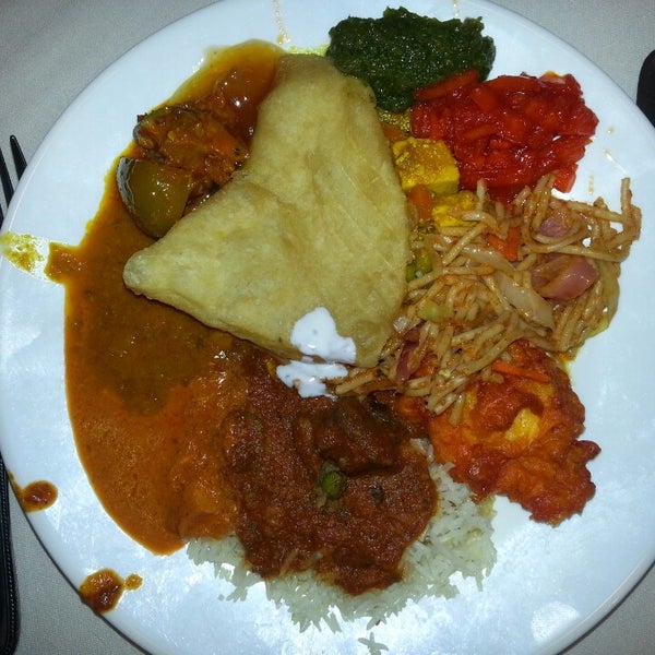 Photo taken at Shalimar Indian Restaurant by Jamie W. on 1/4/2014