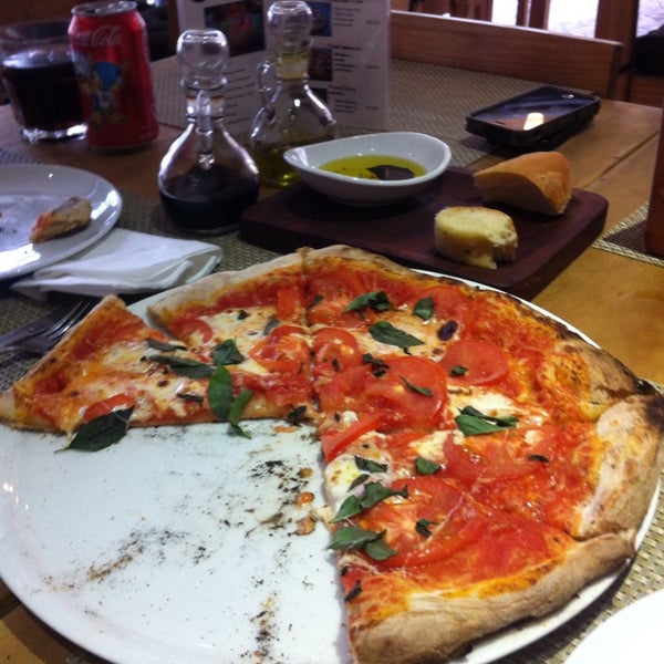 Photo taken at Rioni pizzería napolitana by Karen V. on 4/22/2014