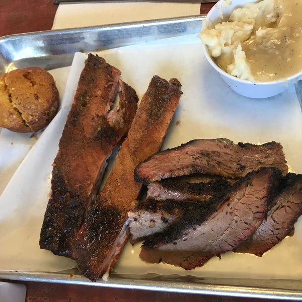 Photo taken at Smoking Pig BBQ Company by Sally I. on 8/7/2018