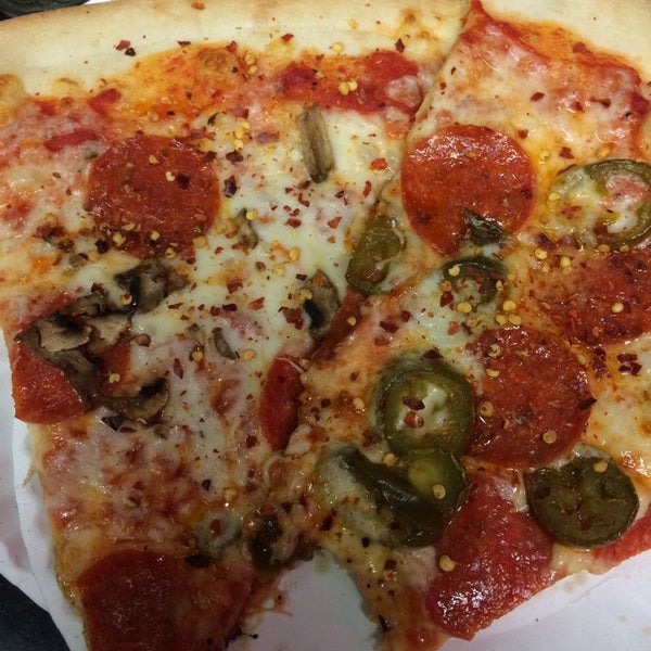 Photo taken at Slices Pizza by Mike on 8/24/2014