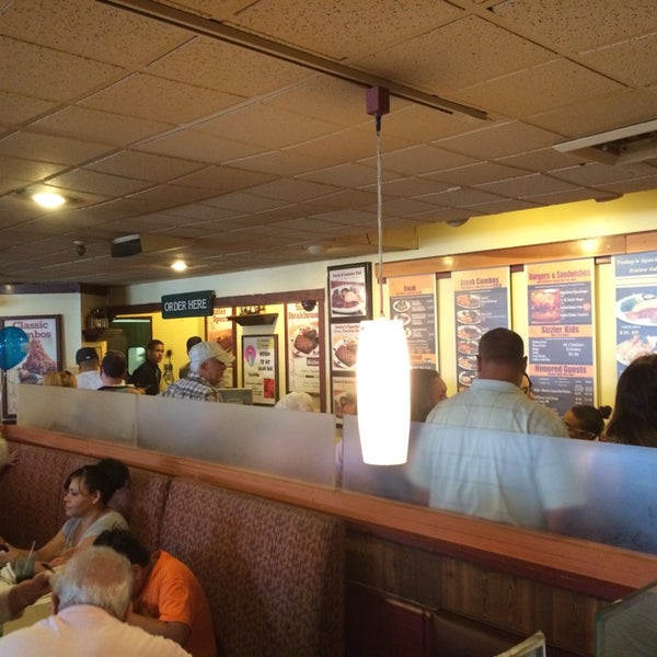 Photo taken at Sizzler by Ian H. on 8/3/2014