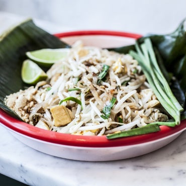 Try a more faithful rendition of pad thai here: banana leaves topped with tangles of pork-fat-rendered rice noodles, tasty dried shrimp, preserved radish, sour tamarind and crunchy peanuts.