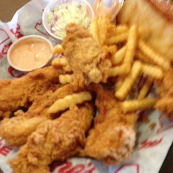 Photo taken at Raising Cane&#39;s Chicken Fingers by Adrian S. on 2/15/2014