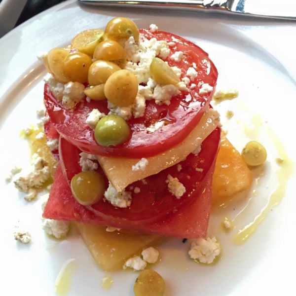 Seasonal tapas of tomatoes and watermelon with cursed goat cheese and olive oil. Beautiful & delicious.