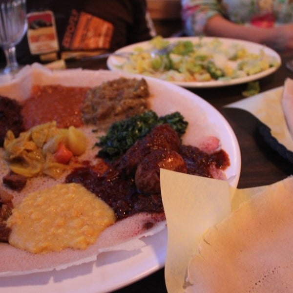 Photo taken at Queen Sheba Ethiopian Restaurant by Nayoen K. on 3/29/2013