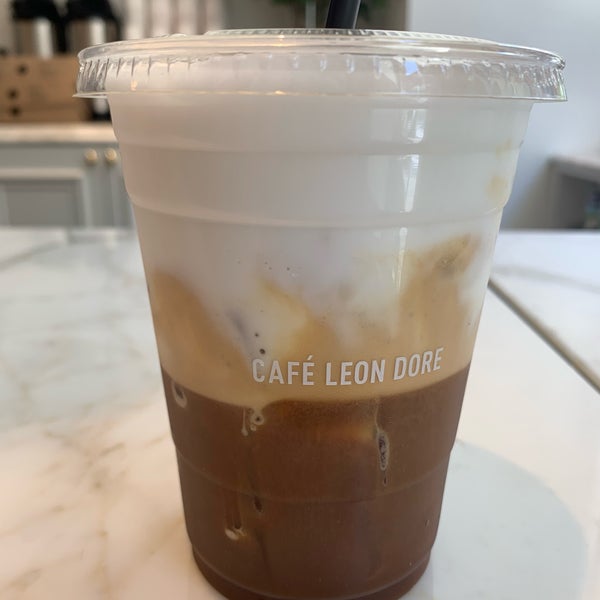 Photo taken at Café Leon Dore by Mike C. on 6/6/2019
