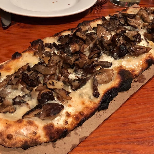 The food is excellent, with stellar service to match. The pizza here is just incredible. Try the mushroom pizza.