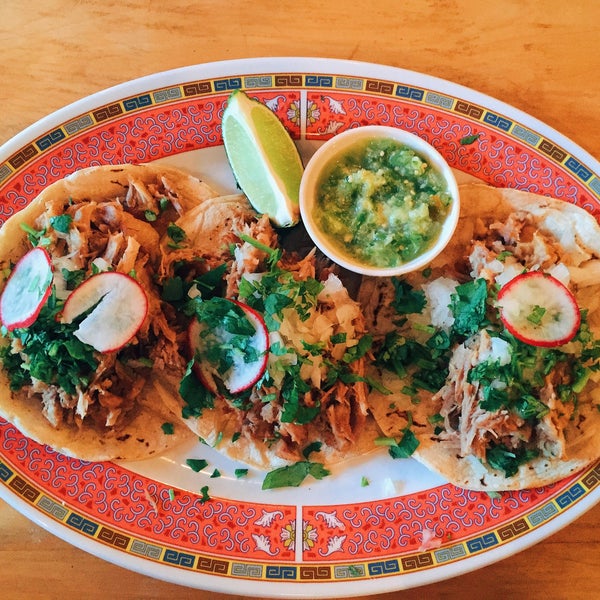 Photo taken at La Capital Tacos by Catherine R. on 9/3/2015