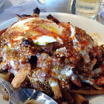 The brunch appetizers at Cook & Collins are too good to pass up. And while the world's largest bacon-iced cinnamon bun is a fantastic way start, we can't get enough of the overloaded "Red Eye Fries."