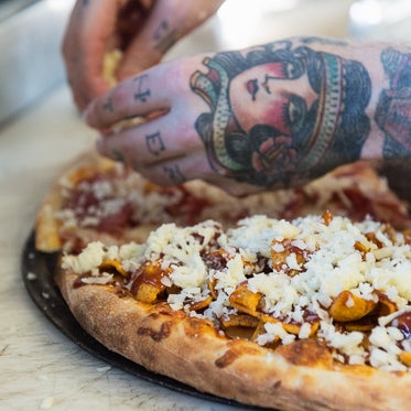 While all of the hot and fresh slices from this dope pizza truck are piled pretty high, we'd be remiss not to include the chili, cheese and Frito-topped 420 in the list.