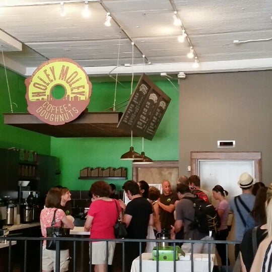 Photo taken at Holey Moley Coffee + Doughnuts by Greg C. on 7/19/2014