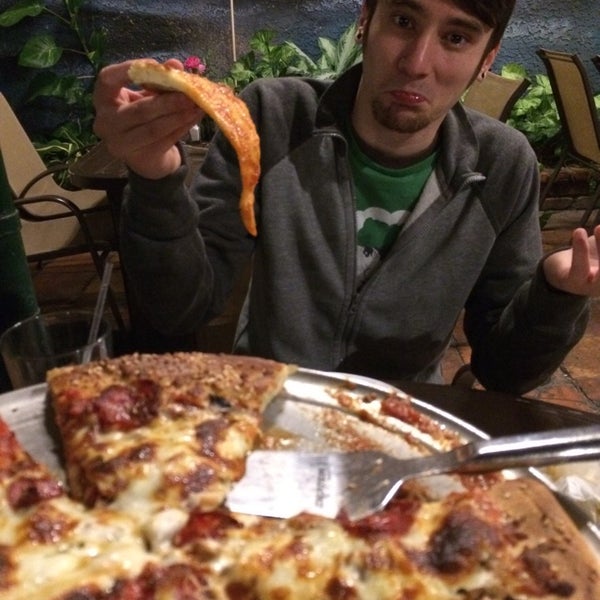 Foto diambil di The Pizza Place &amp; Garden Cafe oleh Izzie A. pada 11/5/2014