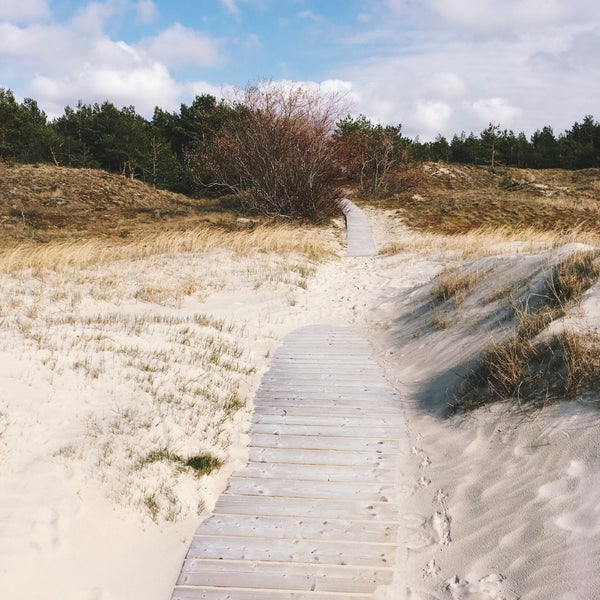 Photo taken at Smiltynės paplūdimys by Augustė B. on 4/8/2019