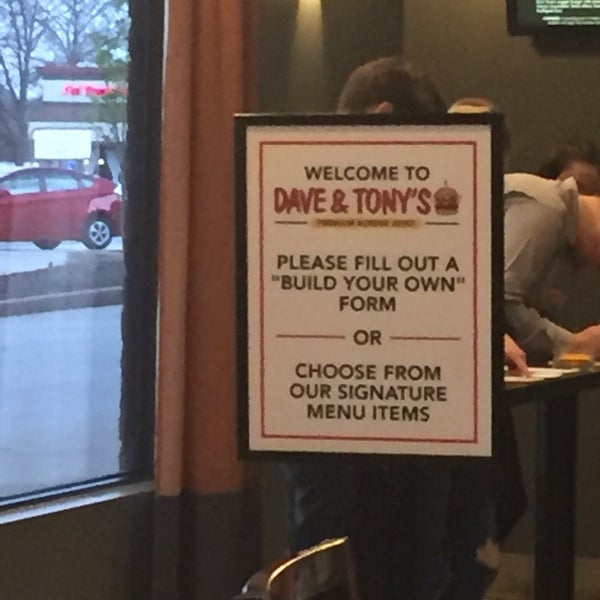 Photo taken at Dave &amp; Tony&#39;s Premium Burger Joint by Brett L. on 3/25/2017