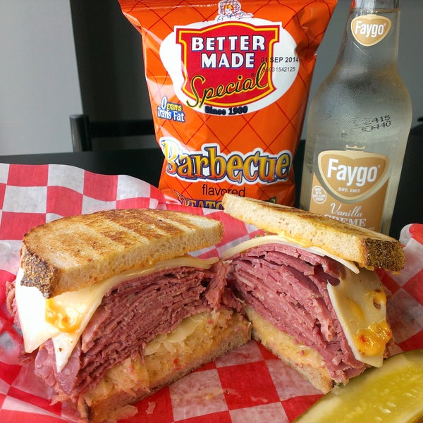 #4 CLASSIC REUBEN - House-cooked Sy Ginsberg Corned Beef w/ Swiss cheese, sauerkraut & Russian dressing on grilled double-baked deli rye