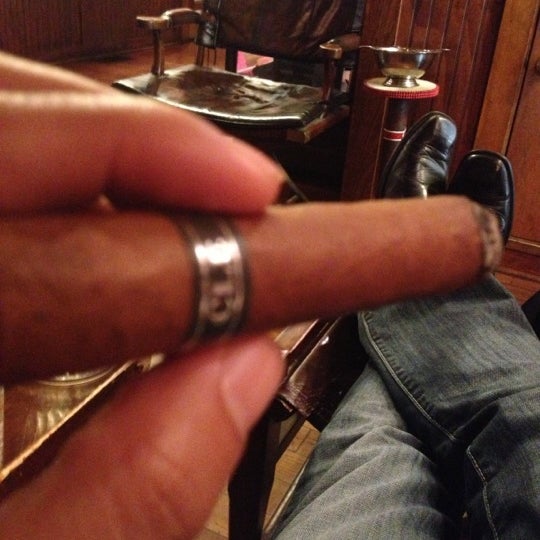 Photo taken at Burns Tobacconist Downtown by L. C. W. on 12/6/2012