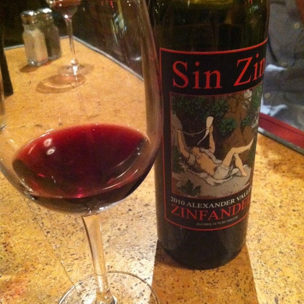 Photo taken at Zin Restaurant &amp; Wine Bar by Sarah G. on 6/30/2013