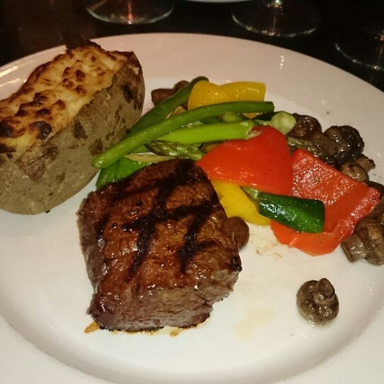 Photo taken at The Keg Steakhouse + Bar - 4th Ave by Nelly C. on 2/14/2014