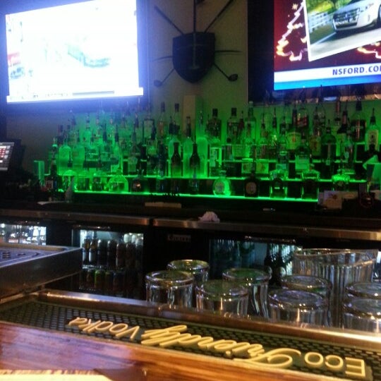 Photo taken at The Range Golf Center &amp; Sports Bar by Christian P. on 12/18/2012