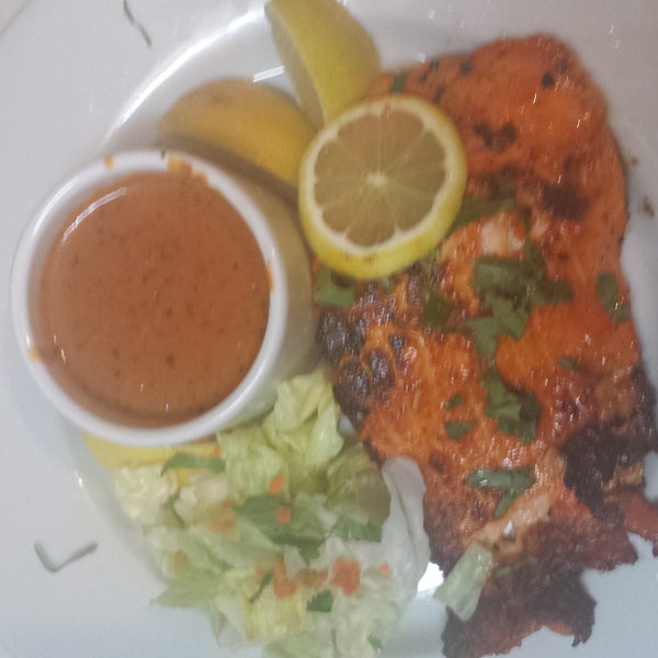 try  our  new special   grilled  salmon  with  korma  s sauce   and  vegetables  on  side