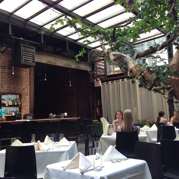 Photo taken at Revel Restaurant and Garden by Natasha H. on 5/31/2013