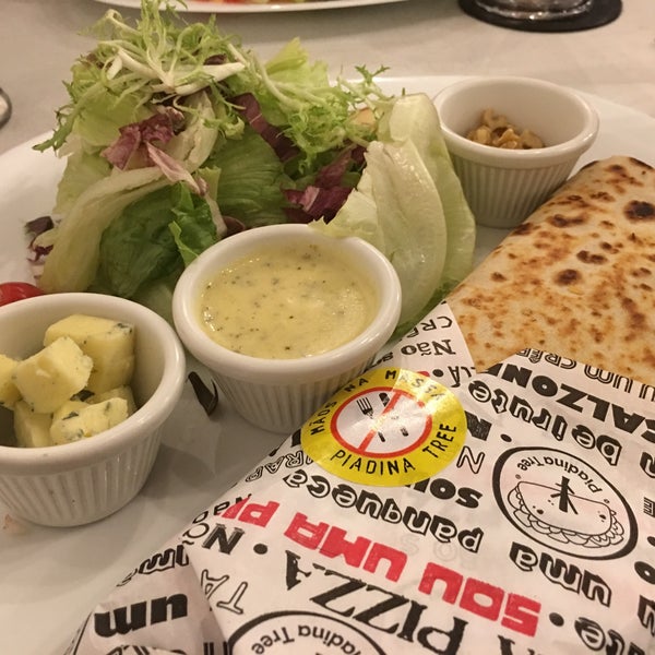 The original Piadina is great - no need to eat here though the delivery is just as good. The blue cheese salad and apple pie and lemon fries are also quite tasty.