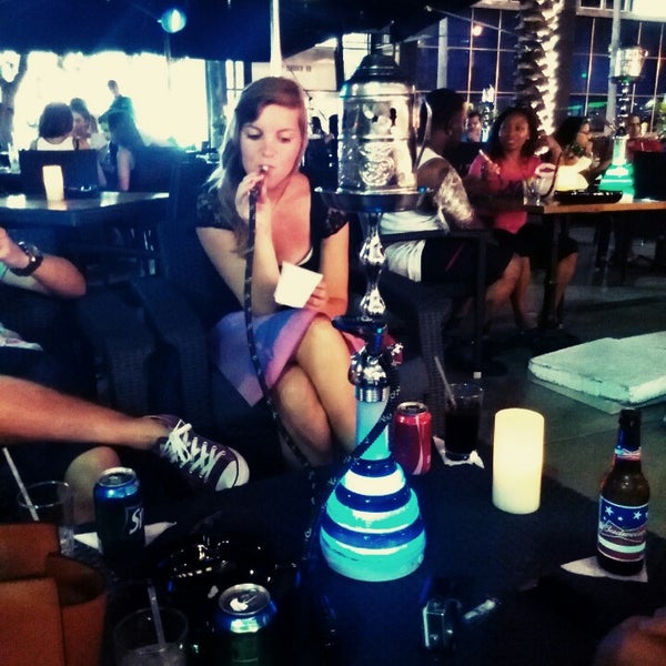 Photo taken at Deco Drive Cigars and Hookah Lounge by Stefanie D. on 7/20/2014