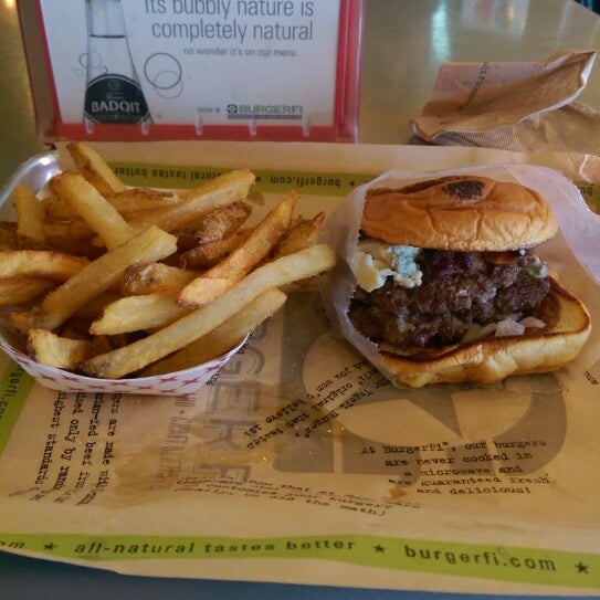 Photo taken at BurgerFi by Jason M. on 2/27/2015