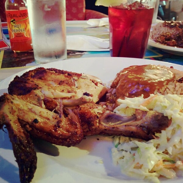 Photo taken at The Real Jerk Restaurant by Betty C. on 8/22/2014