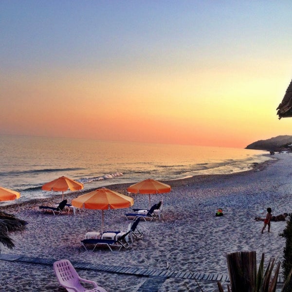 Photo taken at Stelakis Beach by Tüzün on 7/29/2014