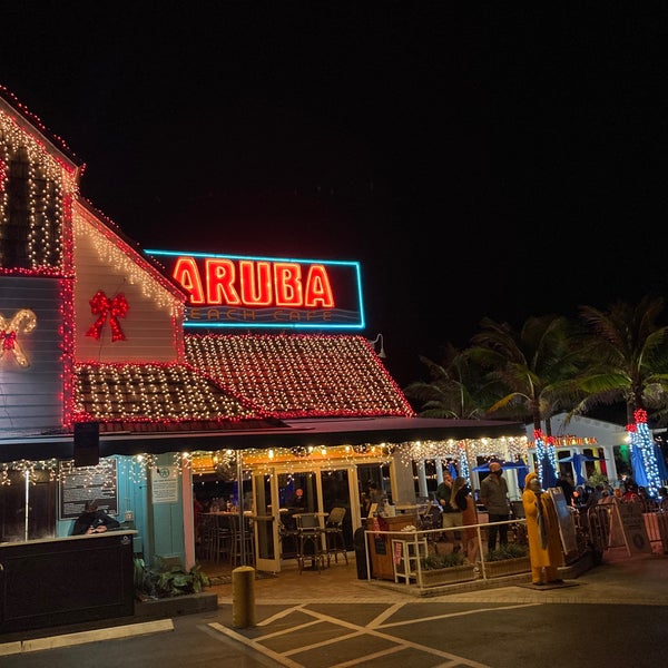Photo taken at Aruba Beach Cafe by Mandar M. on 12/21/2020