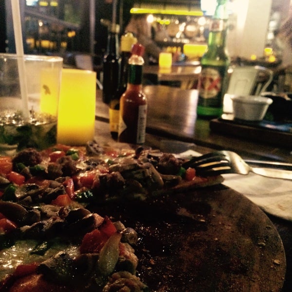 Photo taken at La Fabbrica -Pizza Bar- by Astrid Q. on 7/5/2015