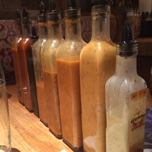 Despite just posting a wall of sauce bottles, I can highly recommend their peri peri chicken, happy hour peach sangria, wings, and cucumber salad. Fries are useful for trying out all their sauces too.