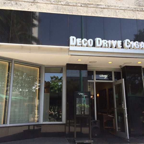 Photo taken at Deco Drive Cigars and Hookah Lounge by Rabbit on 8/6/2015