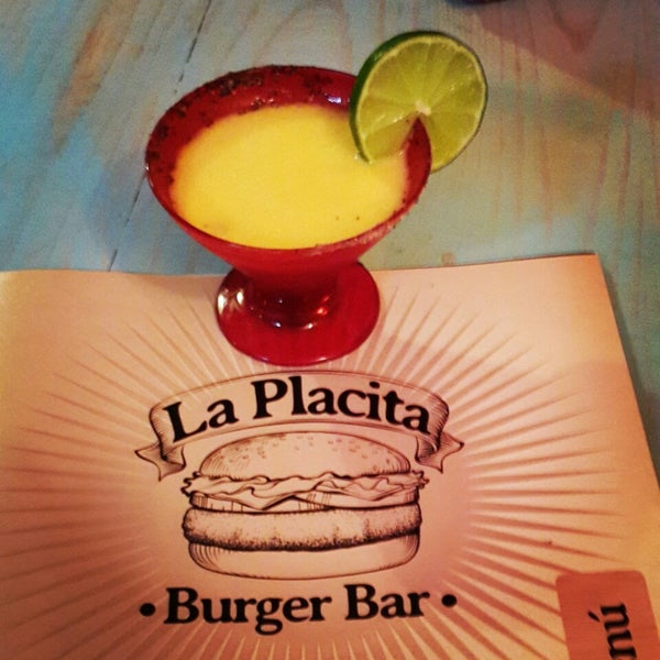Photo taken at La Placita Burger Bar by Violeta C. on 1/25/2014