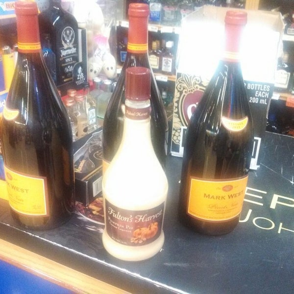 Photo taken at Liquor Outlet Wine Cellars by Tania M. on 11/6/2013