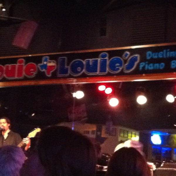 Photo taken at Louie Louie&#39;s Dueling Piano Bar by Alaine J. on 5/18/2013