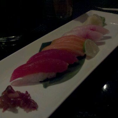 Photo taken at East Moon Asian Bistro &amp; Sushi by Dejay N. on 3/11/2012