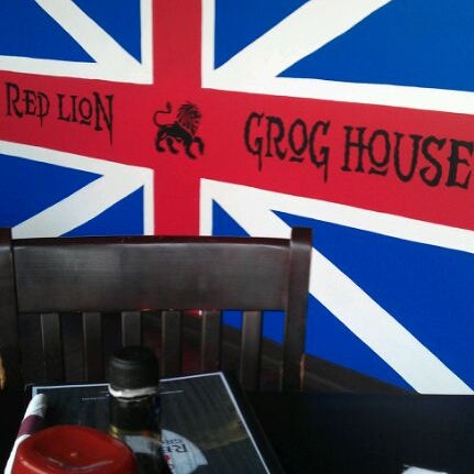 Photo taken at Red Lion Grog House by Chris T. on 4/16/2012