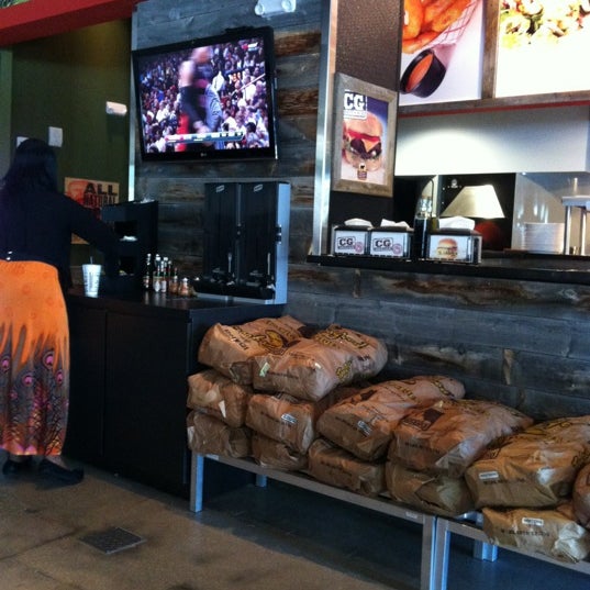 Photo taken at CG Burgers-Merrick by Tu M. on 4/19/2012